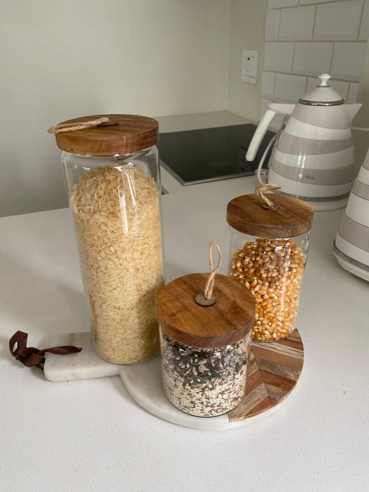 Glass storage jar with wood lid